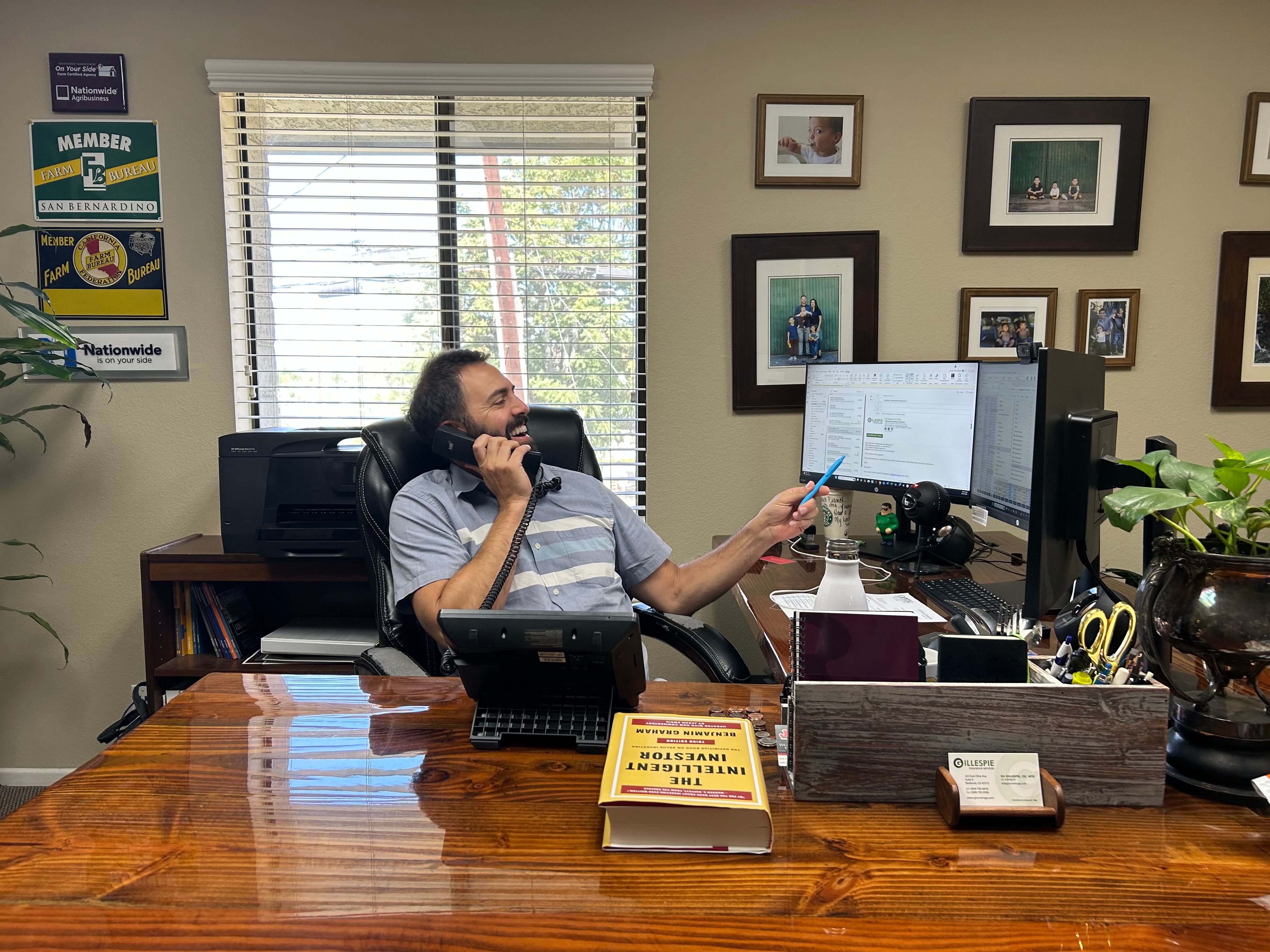 Eli Gillespie working at his desk in the Redlands office.
